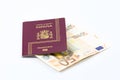 Spanish passport with european union currency banknotes Royalty Free Stock Photo