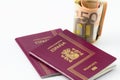 Spanish passport with european union currency banknotes Royalty Free Stock Photo