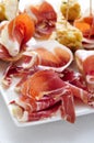 spanish pinchos, spanish tortilla and serrano ham served on bread Royalty Free Stock Photo