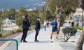 Spanish police wearing protective mask patrol to stop and warn the citizens to get back to their houses as a quarantine is set Royalty Free Stock Photo