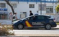 Spanish police wearing protective mask patrol to stop and warn the citizens to get back to their houses as a quarantine is set Royalty Free Stock Photo