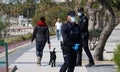 Spanish police wearing protective mask patrol to stop and warn the citizens to get back to their houses as a quarantine is set Royalty Free Stock Photo