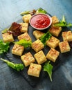 Spanish Potato Frittata tapas with tomato sauce on stone board Royalty Free Stock Photo