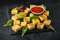 Spanish Potato Frittata tapas with tomato sauce on stone board Royalty Free Stock Photo