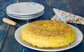Spanish potato omelet on wooden background. Royalty Free Stock Photo