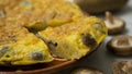 Spanish potato omelette with Japanese shitake mushrooms and onion. Traditional tapas recipe.