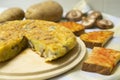 Spanish potato omelette with Japanese shitake mushrooms and onion. Traditional tapas recipe.