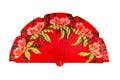 Spanish red open hand fan, decorated with floral motifs, isolated on white background Royalty Free Stock Photo