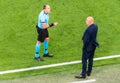 Spanish referee Antonio Mateu Lahoz making an oral warning to Russia national football team coach Stanislav Cherchesov during EURO