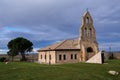 Spanish romanesque church in a stormy day with cloudy and dramatic sky , palencia, spain Royalty Free Stock Photo