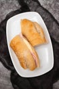 a spanish rosca de jamon serrano, ham sandwich, on a white plate Royalty Free Stock Photo