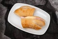 a spanish rosca de jamon serrano, ham sandwich, on a white plate Royalty Free Stock Photo