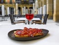 Spanish rose wine and Jamon Iberico ham sandwich at a restaurant, Pamplona Spain Royalty Free Stock Photo