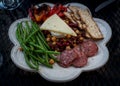 Spanish salad with beans, crackers, preserved meat and cheese Royalty Free Stock Photo