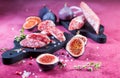 Spanish salami fuet with fresh figs - dry-cured and natural fermented sausages Royalty Free Stock Photo