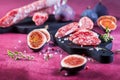 Spanish salami fuet with fresh figs - dry-cured and natural fermented sausages Royalty Free Stock Photo