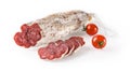 Spanish sausage longaniza whole and slices and two cherry tomatoes isolated on white background. Dry-cured longanisa salami of Royalty Free Stock Photo