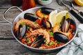 Spanish seafood paella with mussels, shrimps and chorizo sausages in traditional pan Royalty Free Stock Photo