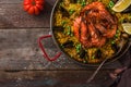 Spanish Seafood Paella Rice Dish with Fresh Shellfish Served with Lemon Wedges in Pan, copy space Royalty Free Stock Photo