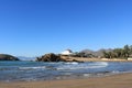 Spanish seascape of a sandy beach with crashing waves