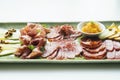 Spanish serrano ham chorizo sausage and cheese tapas platter Royalty Free Stock Photo