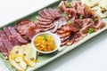 Spanish serrano ham chorizo sausage smoked meats cheese tapas pl Royalty Free Stock Photo