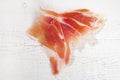 Spanish Serrano Ham Jamon sliced on white Royalty Free Stock Photo