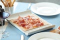 Spanish sliced pork jamon on the restaurant table Royalty Free Stock Photo