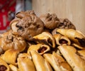 Spanish snacks and street food, baked pie empanadilla with different filling on market in San-Sebastian, Spain Royalty Free Stock Photo