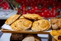 Spanish snacks and street food, baked pie empanadilla with different filling on market in San-Sebastian, Spain Royalty Free Stock Photo