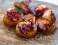 Spanish starter in fish restaurant in Getaria, grilled octopus with roasted potatoes and paprika, Basque Country, Spain