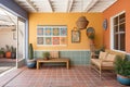 spanish style patio with terracotta floor and wall hangings Royalty Free Stock Photo