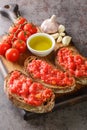 Spanish style toast with tomato Pan con tomate closeup on the wooden board. Vertical Royalty Free Stock Photo