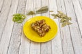 Spanish tapa of artichoke flowers sautÃÂ©ed with fried serrano ham, parsley garnishes, pepper slices and oregano on light Royalty Free Stock Photo