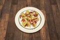 A Spanish tapa of fried artichoke hearts with strips of serrano ham Royalty Free Stock Photo