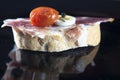 Spanish tapa of serrano ham served on sliced bread Royalty Free Stock Photo