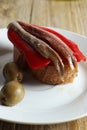 Spanish tapa - slice of bread with roasted red pepper, anchovy and olive oil