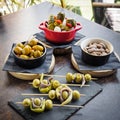 Spanish tapas, banderillas, gildas, olives and almonds