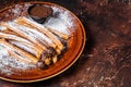 Spanish tapas churros with sugar and chocolate sauce. Dark background. Top view. Copy space Royalty Free Stock Photo