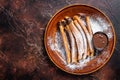 Spanish tapas churros with sugar and chocolate sauce. Dark background. Top view. Copy space Royalty Free Stock Photo