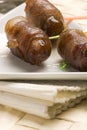 Spanish tapas. Date wrapped in bacon. Royalty Free Stock Photo