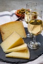 Spanish tapas, manchego cheese made, green olives served with glasses of dry fino sherry wine Royalty Free Stock Photo