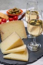 Spanish tapas, manchego cheese made, green olives served with glasses of dry fino sherry wine Royalty Free Stock Photo