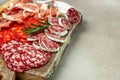 Spanish tapas sliced sausages salami, fuet and chorizo on a wooden board. place for text, top view Royalty Free Stock Photo