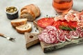 Spanish tapas sliced sausages salami, fuet and chorizo on a wooden board. place for text, top view Royalty Free Stock Photo