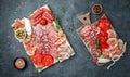 Spanish tapas sliced sausages salami, fuet and chorizo on a wooden board. place for text, top view Royalty Free Stock Photo