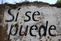Spanish text painted on a wall: si se puede Royalty Free Stock Photo