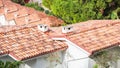 Spanish Tiles for roof. Red roof tiles on houses as background image. Shingles roofing surface tiles overlay pattern Royalty Free Stock Photo