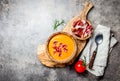 Spanish tomato soup Salmorejo served in olive wooden bowl with ham jamon serrano on stone background. Top view, copy Royalty Free Stock Photo