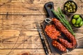 Spanish traditional tapas Sliced chorizo salami, chorizo sausage. wooden background. Top view. Copy space Royalty Free Stock Photo